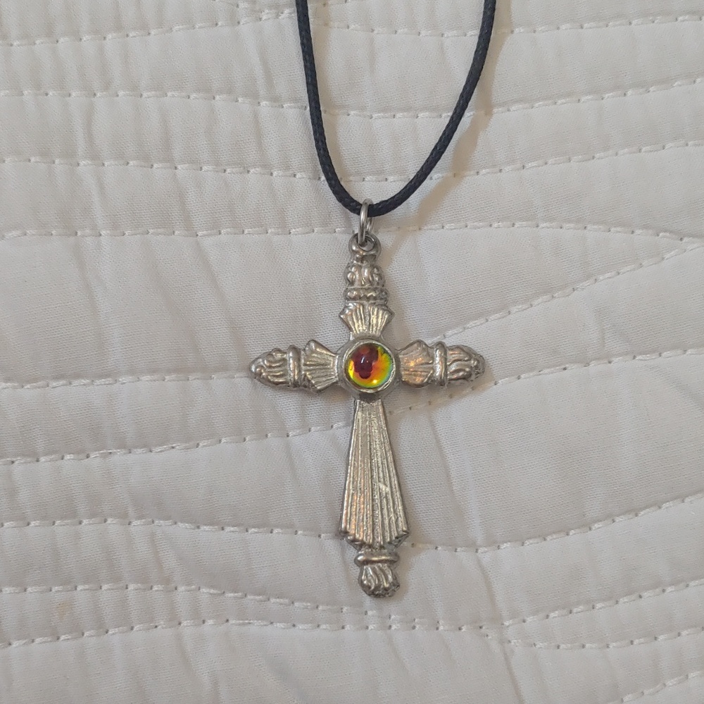 Cross necklace with gemstone in center of cross